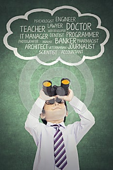 Boy looking his dream with binocular