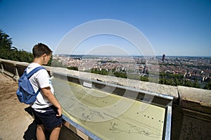 Boy looking at Lyon city