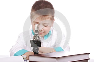 Boy looking into microscope