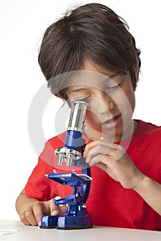 Boy looking through microscope