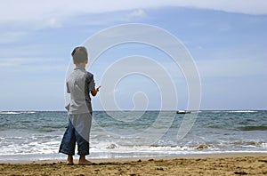 Boy Looking at the Ocean