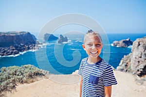 Boy looking out on the ocean. Lagos, Algarve Coast, Portugal