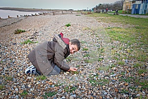 Boy looking for shells