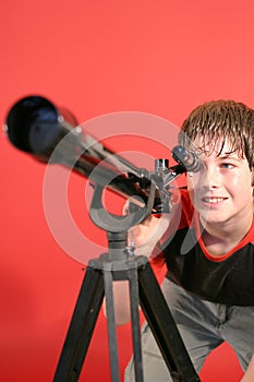 Boy looking thru telescope