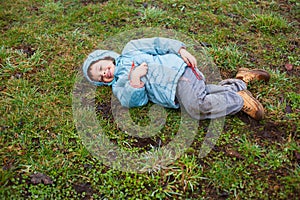 Boy lying on grass