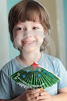 Boy made of paper christmas tree