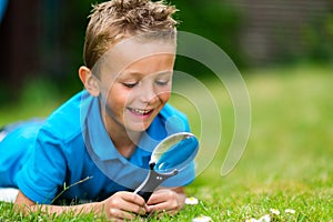 Boy with magnifier