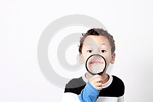 Boy with magnifying glass