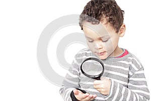 Boy with magnifying glass