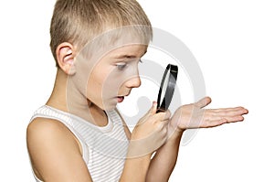 Boy with magnifying glass