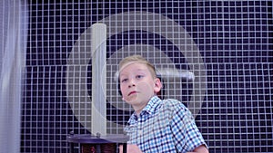 Boy makes experiment with electromagnetic equipment in science museum