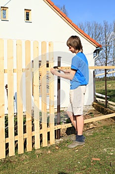 Boy making fence