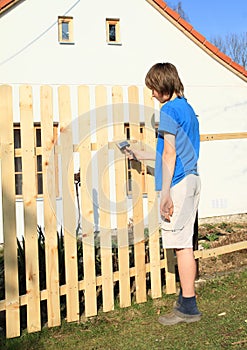Boy making fence