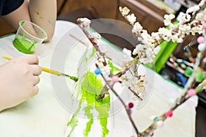Boy making flowering apple tree garden layout.