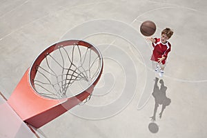 Boy making jump shot