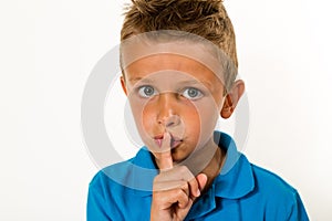 Boy making keep quiet gesture