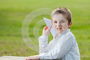 Boy making paper plane