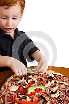 Boy making pizza