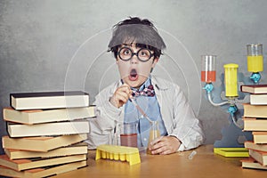Boy is making science experiments in a laboratory photo