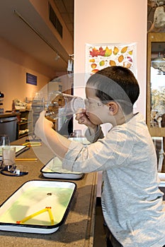 Boy making soap bubble