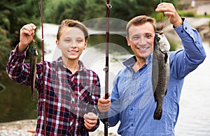 Boy and man fishing