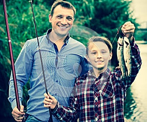 Boy and man fishing