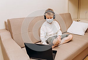 Boy mask learning online lesson technology laptop