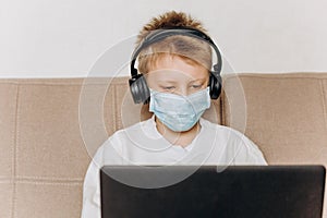 Boy mask learning online lesson technology laptop