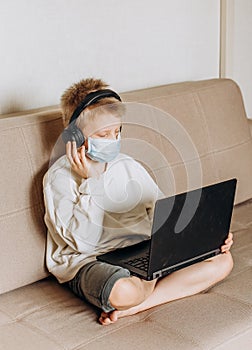 Boy mask learning online lesson technology laptop