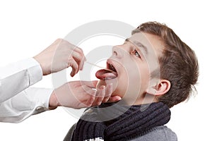 Boy medical exam pharynx and tonsils photo