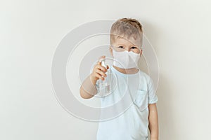 Boy in Medical Face Mask Hold Sanitiser Bottle