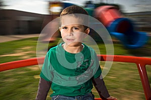 Boy on merry go round