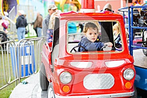 Boy on a Merry-Go-Round Firetruck