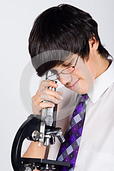 Boy with microscope