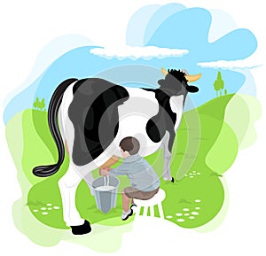A boy milking a cow photo