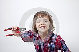Boy with missing tooth and combination pliers