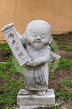 Boy monk statue at Hsi Lai Buddhist Temple, California.