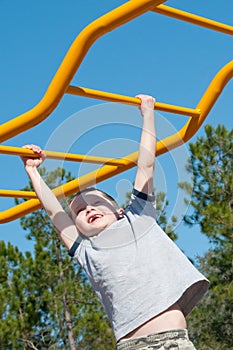 Boy on monkey bars