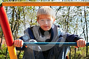 Boy on monkey bars