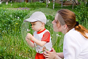 Boy with mother and dandelion