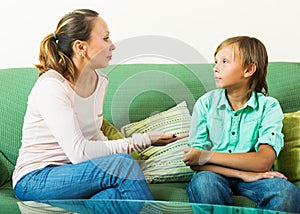 Boy and mother having serious talking