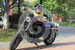 Boy on motorcyle photo