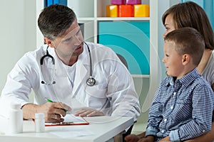 Boy with mum on pediatric visit