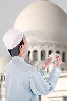 Boy muslim praying at mosque