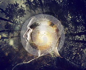 Boy with a mystical forest in mind. Double exposure