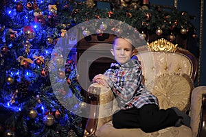 Boy near the Christmas tree