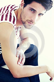 The boy next door. Closeup cropped portrait of a handsome man looking at you wearing casual jeans and a t-shirt.