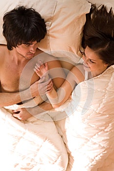 Boy with nice girl on bed