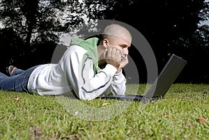 Boy with notebook in park