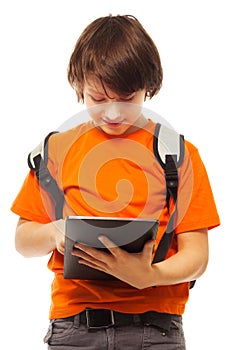 Boy occupied with tablet computer